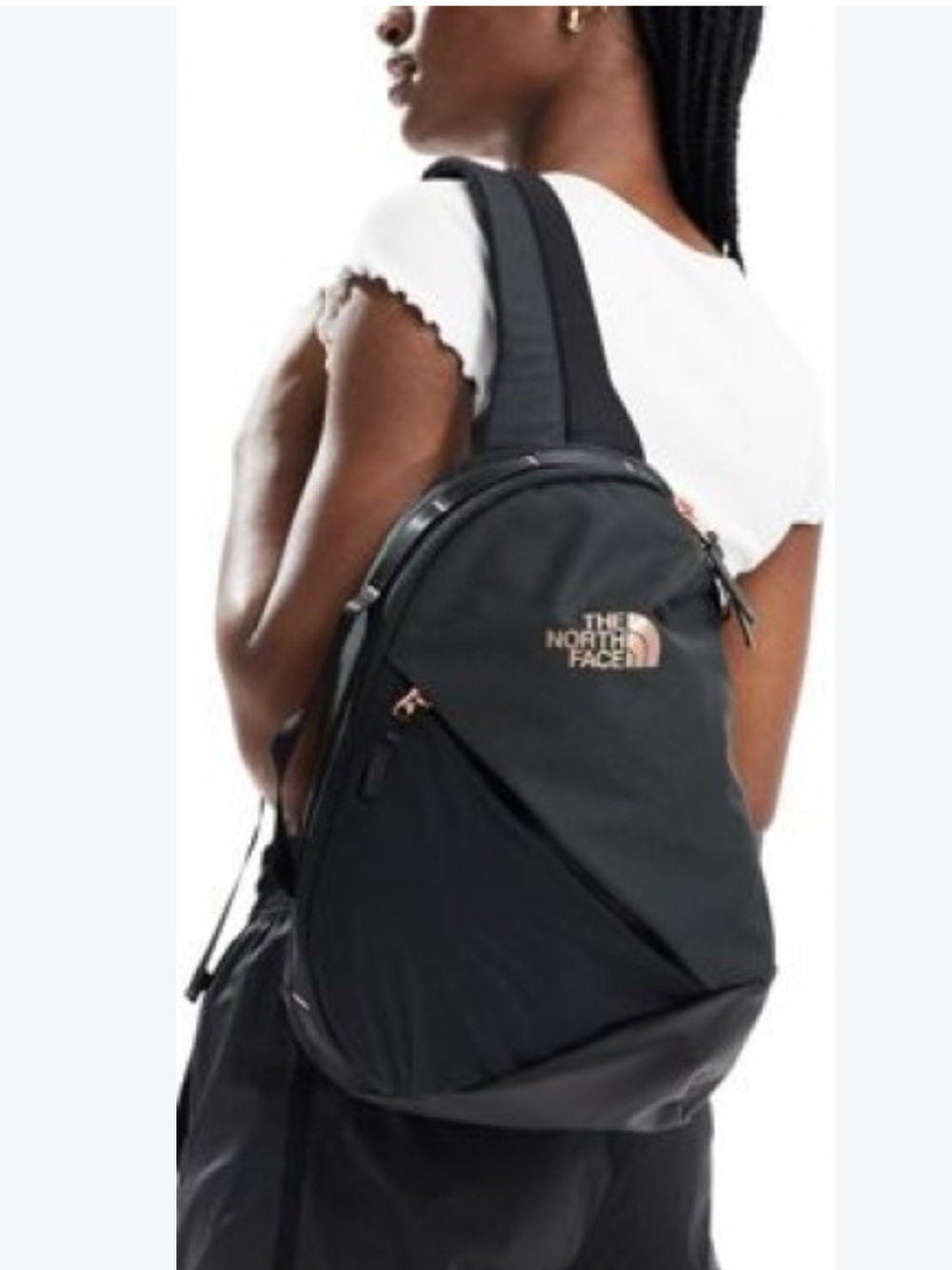 North Face Women's Isabella Sling Bag in black with rose gold hardware branding